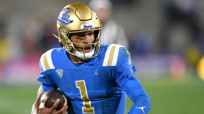 Nov 27, 2021; Pasadena, California, USA; UCLA Bruins quarterback Dorian Thompson-Robinson (1) runs for 17 yards and a first down against the California Golden Bears in the second half at the Rose Bowl.